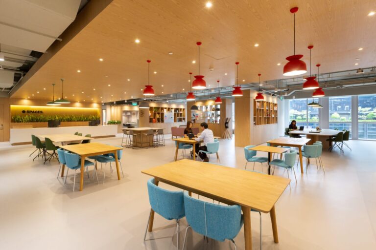 Modern virtual office coworking space in Singapore with shared desks and meeting area