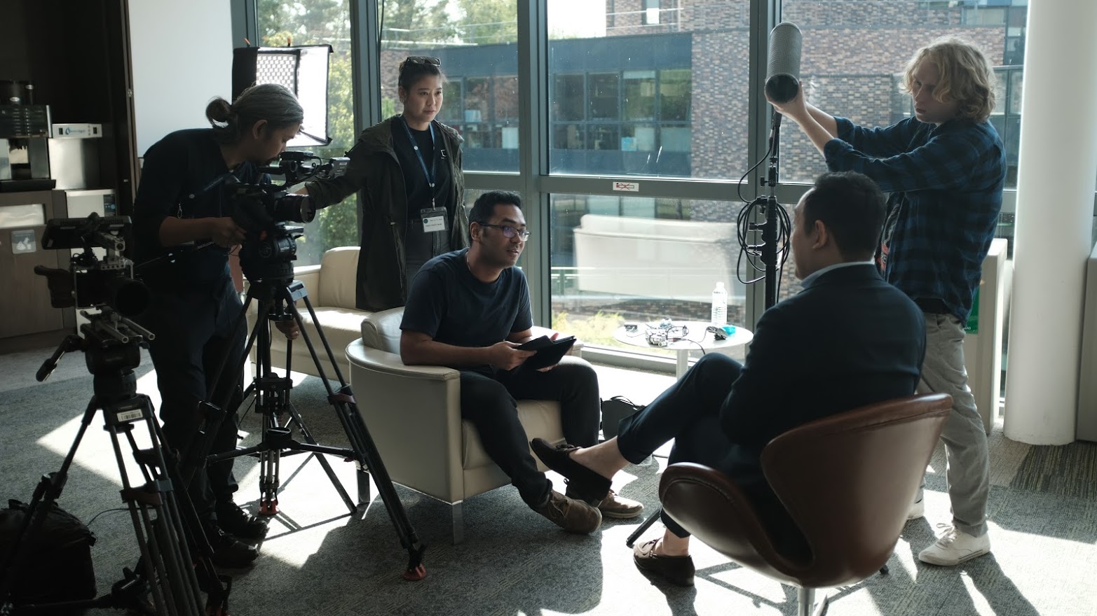 Video production companies Singapore filming a professional interview