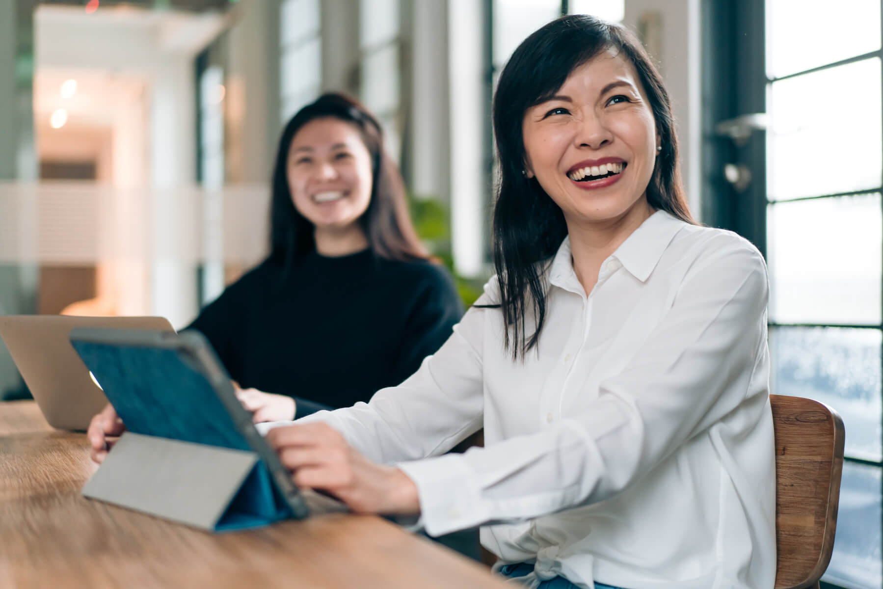 Human resources consultant discussing recruitment solutions with a client