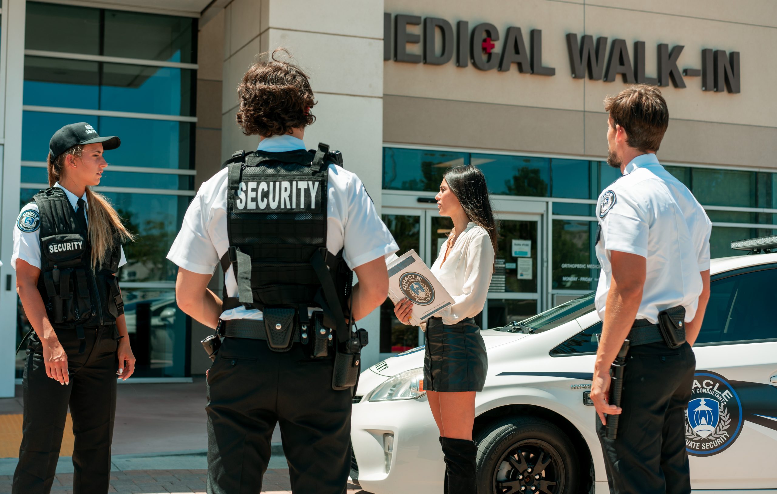 Best Security Services Singapore Security guards assisting visitors outside a commercial building in Singapore