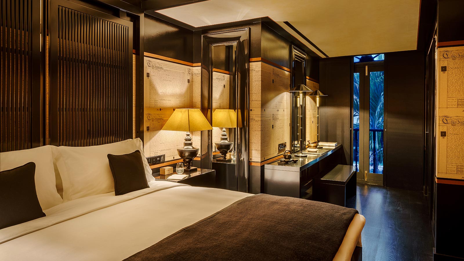 Upscale boutique hotel suite with warm lighting and premium furnishings