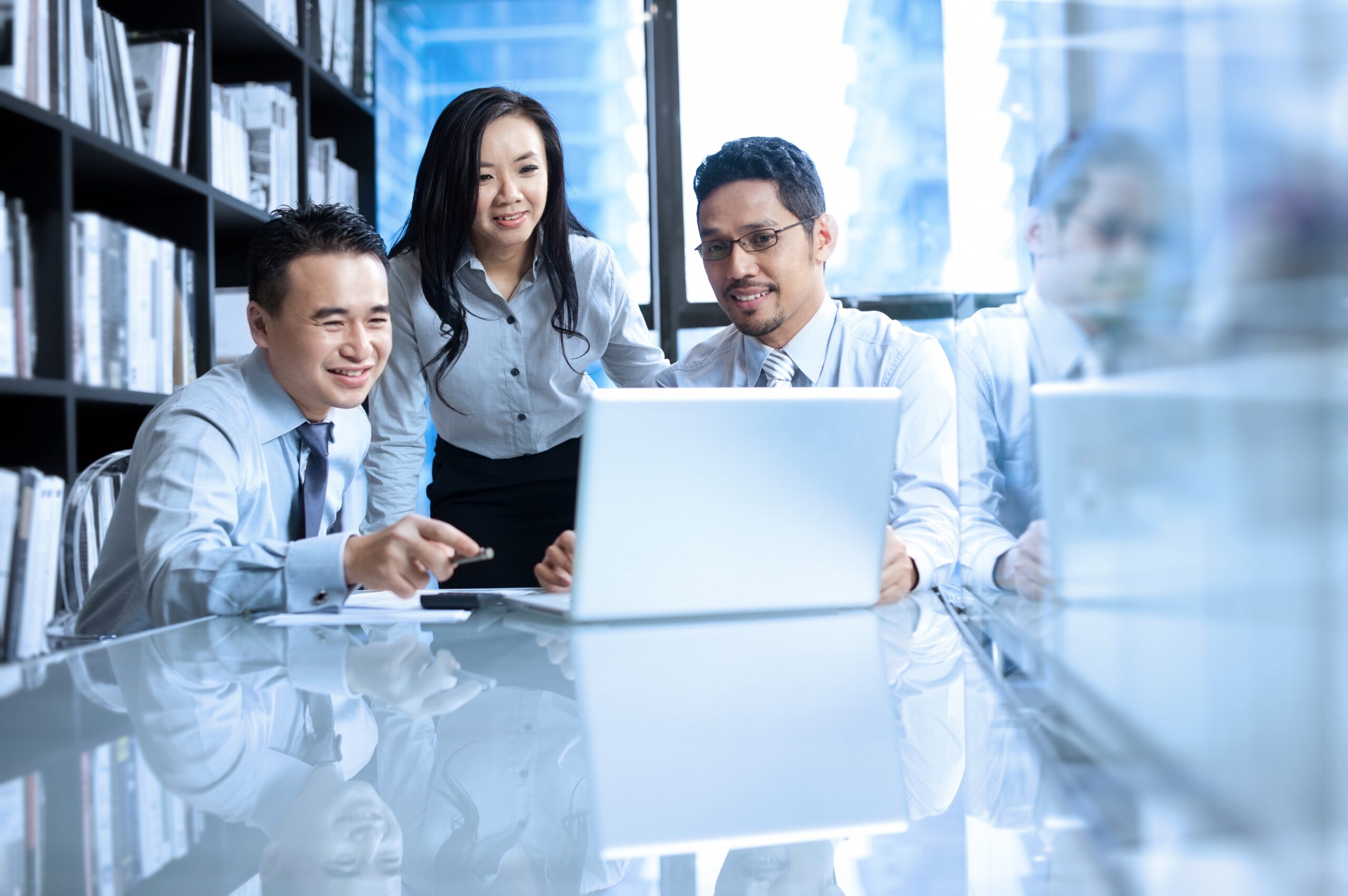 Best Business Consultants Singapore Corporate consulting team reviewing business plans and financial reports