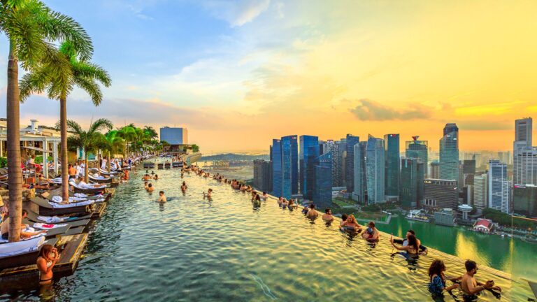 Infinity pool with Singapore skyline at sunset